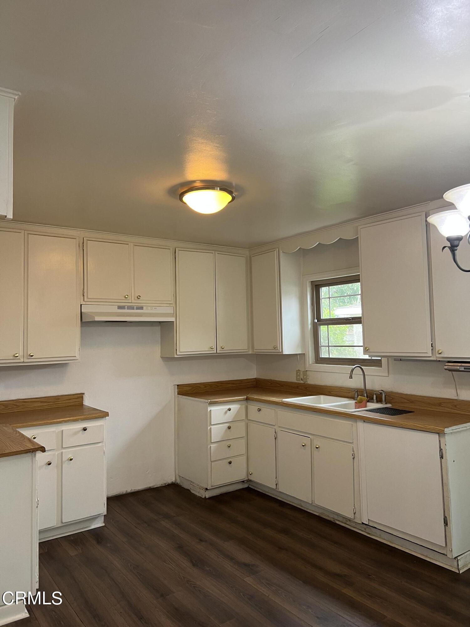 4840 Saviers Road Oxnard, CA 93033 - Photo 10 of 24 a kitchen that has a sink and a stove in it