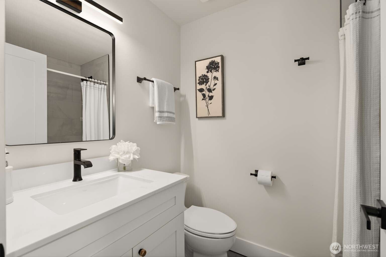 10811 Northeast 154th Court Bothell, WA 98011 - Photo 11 of 28 a bathroom with a sink toilet and mirror