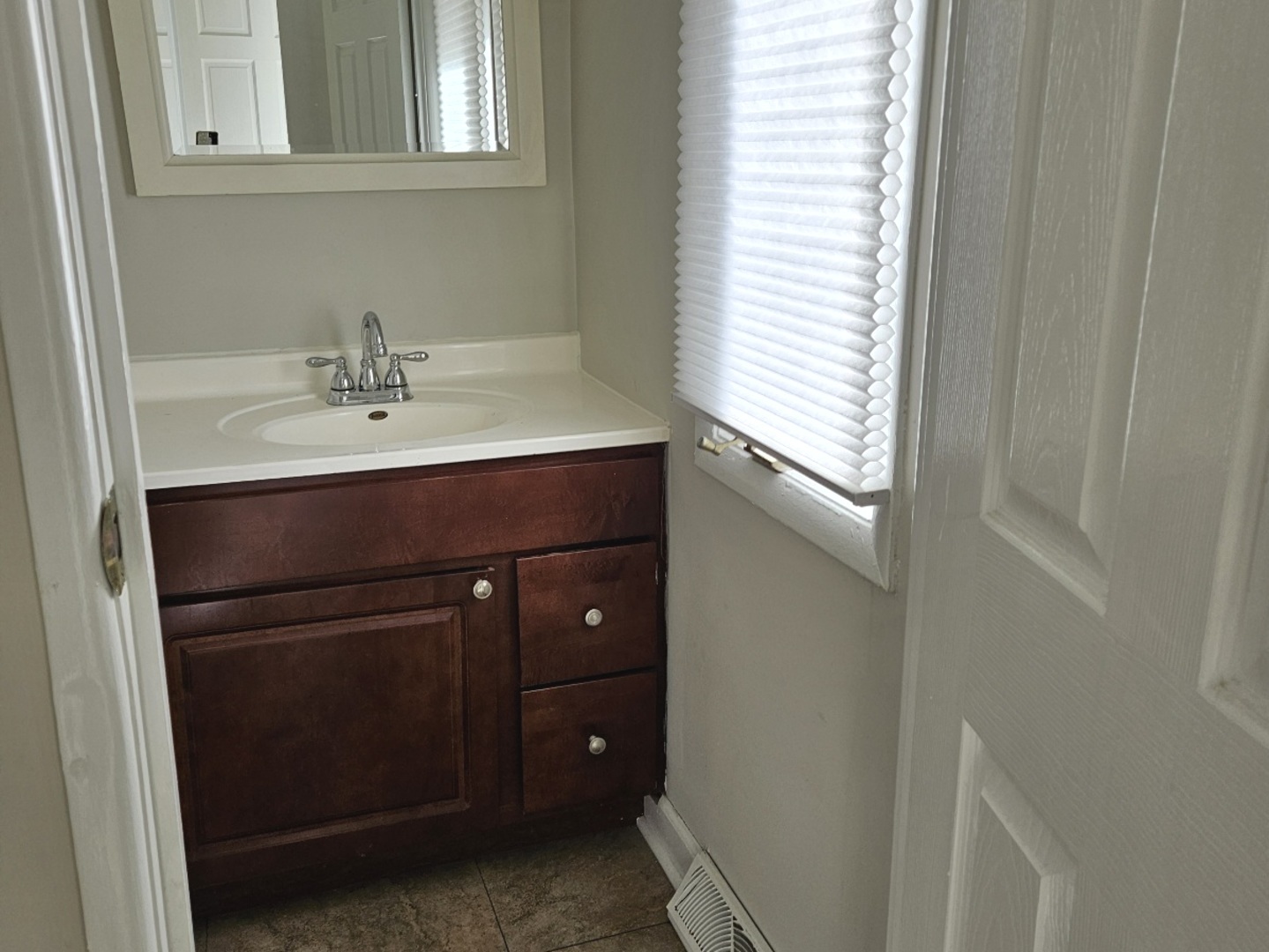 228 Monroe Road Bolingbrook, IL 60440 - Photo 6 of 14 a bathroom with a sink and a mirror