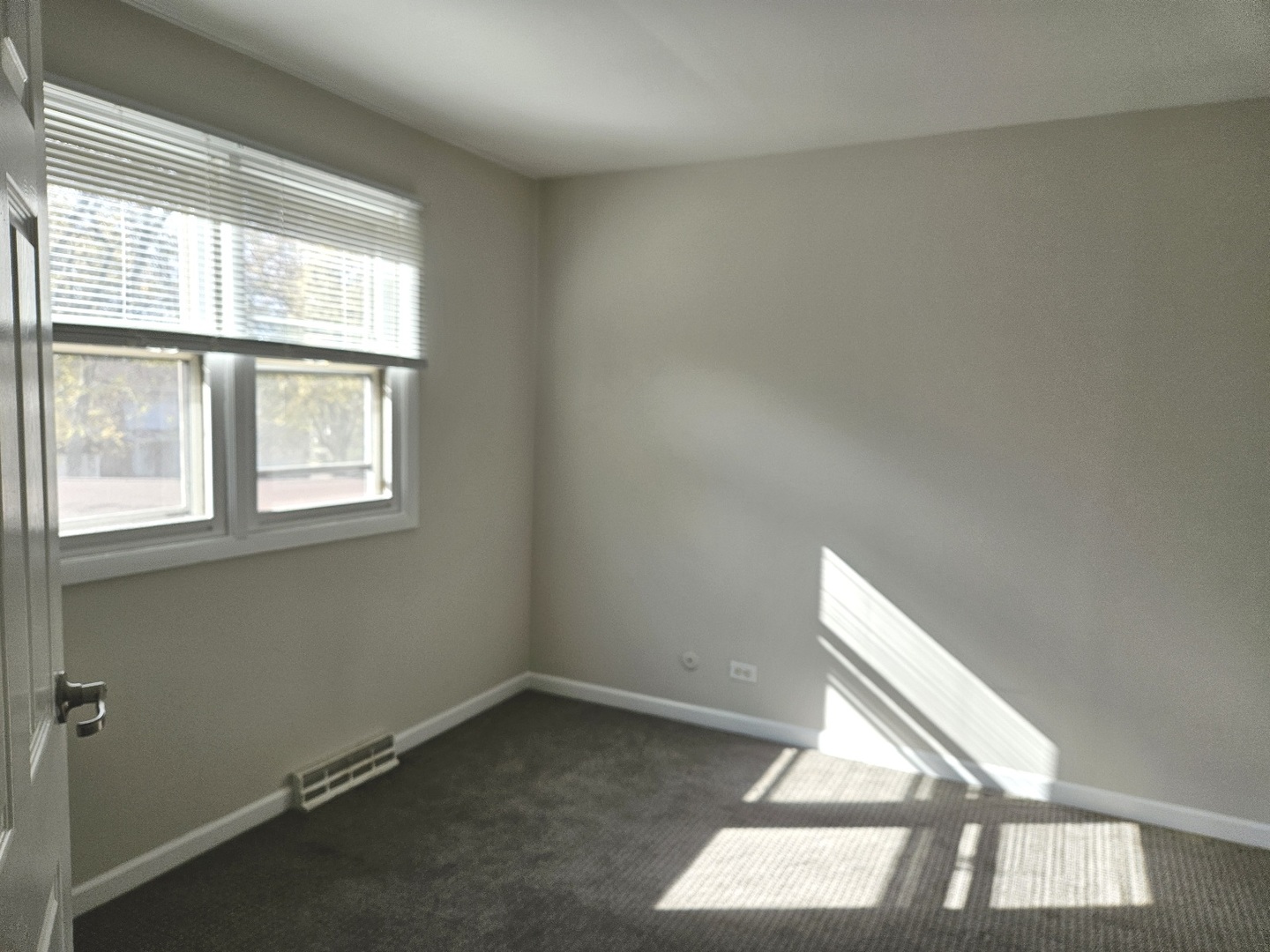 228 Monroe Road Bolingbrook, IL 60440 - Photo 10 of 14 a view of an empty room with a window