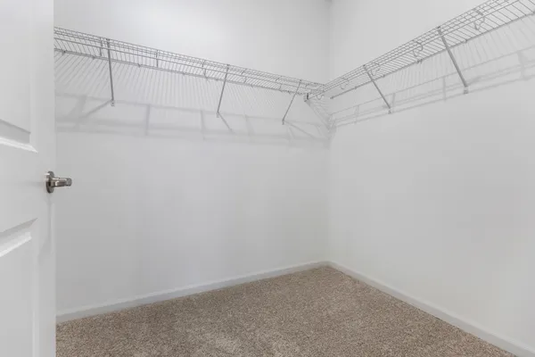 a bathroom with a toilet a sink a mirror a bathtub and vanity