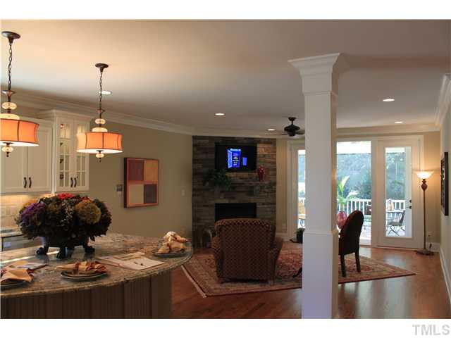 4909 Great Meadows Court Raleigh, NC 27609 - Photo 8 of 25 Stacked stone fire place with flat sccreen HDTV Den/Family/Great Room