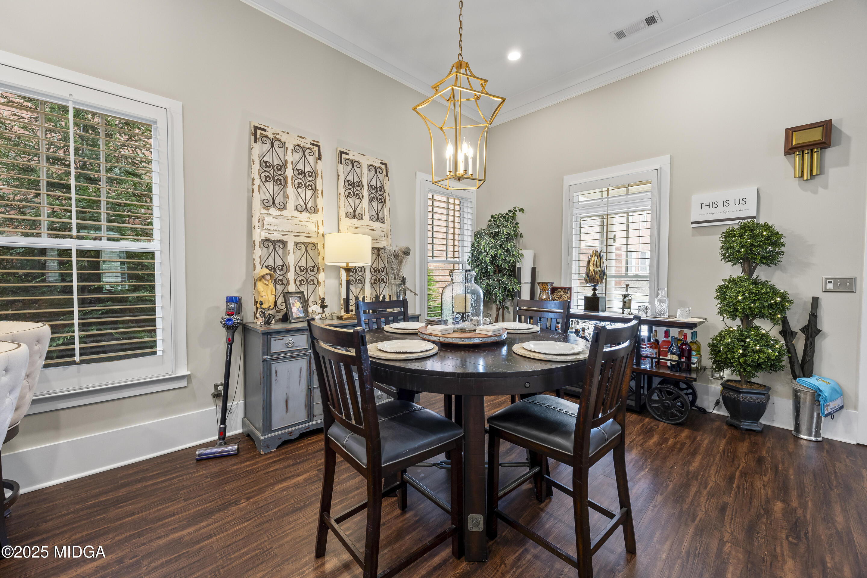 4121 North Swann Street Covington, GA 30014 - Photo 11 of 52 a view of a dining room with furniture window and wooden floor