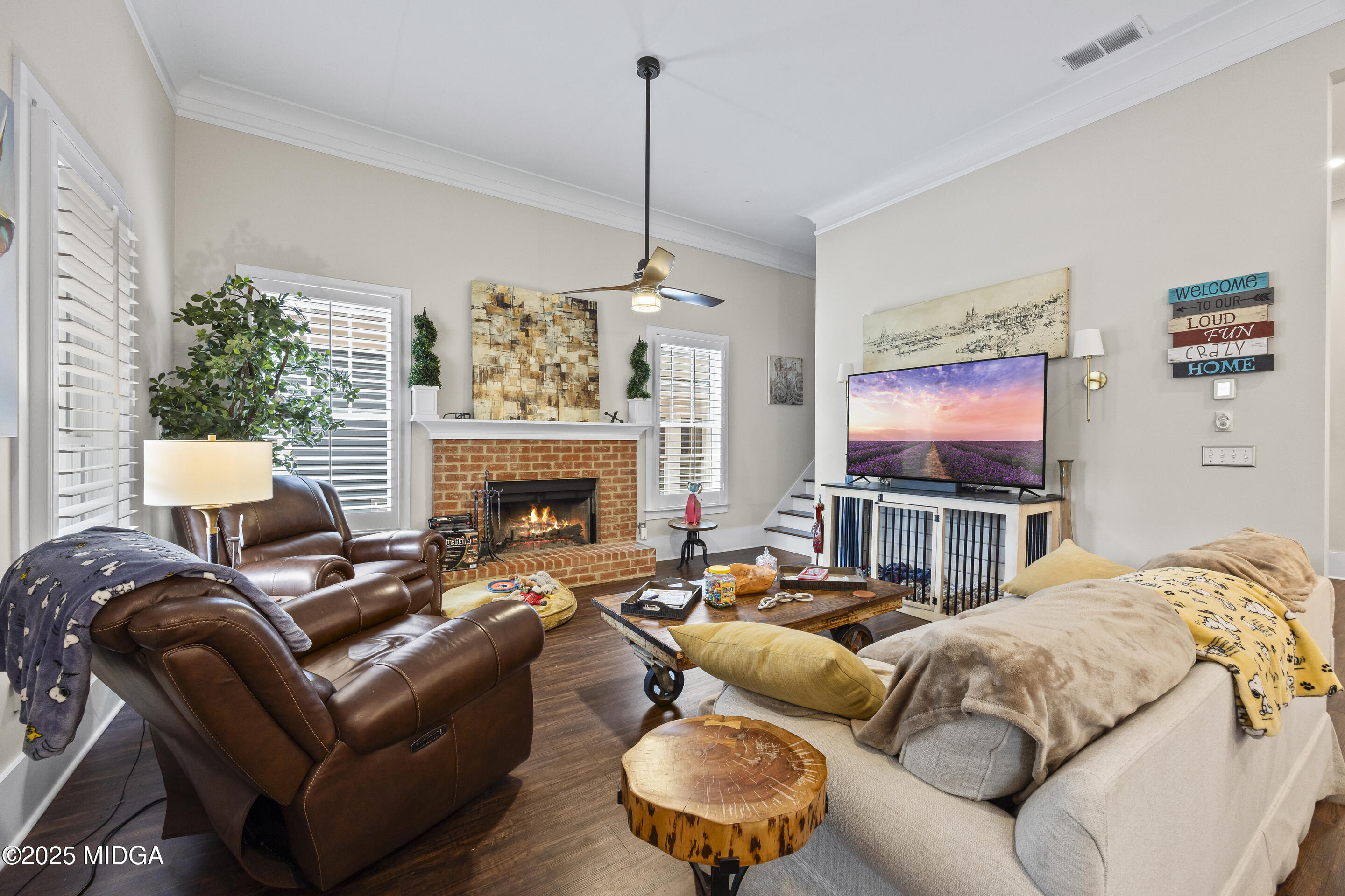 4121 North Swann Street Covington, GA 30014 - Photo 2 of 52 a living room with furniture a flat screen tv and a fireplace