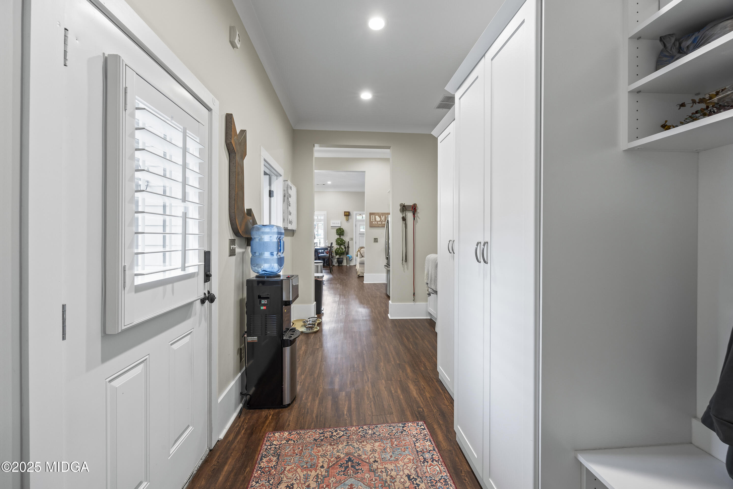 4121 North Swann Street Covington, GA 30014 - Photo 21 of 52 a view of a hallway with wooden floor and windows