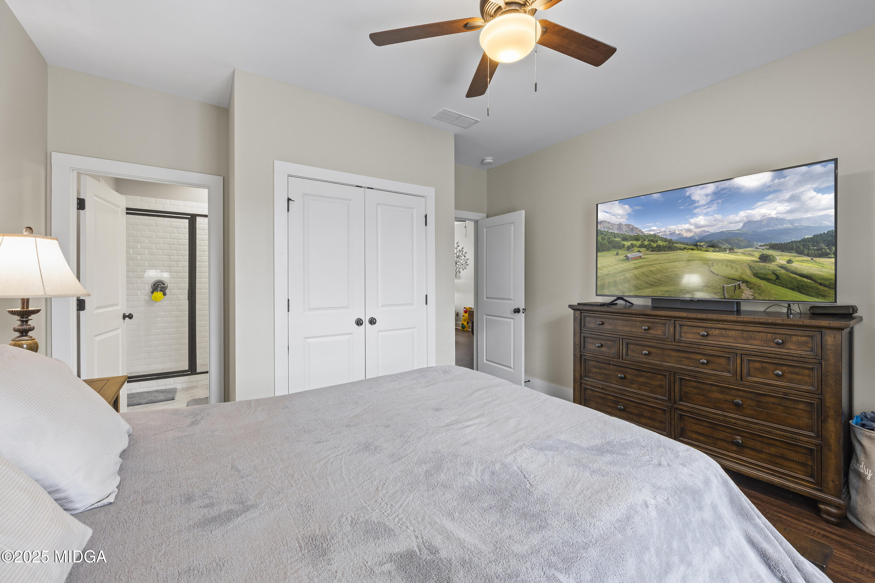 4121 North Swann Street Covington, GA 30014 - Photo 30 of 52 a bedroom with a bed and a flat screen tv