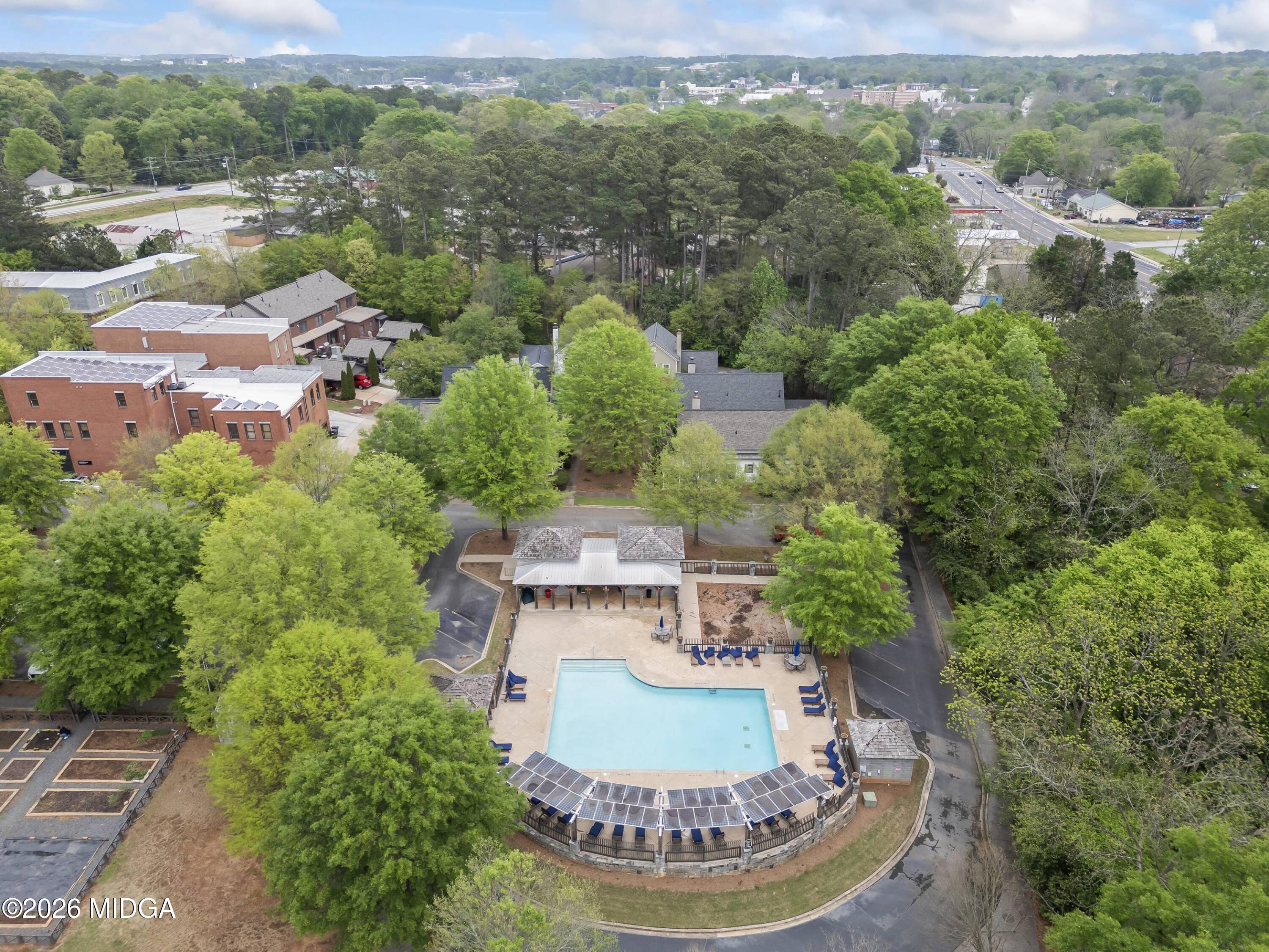4121 North Swann Street Covington, GA 30014 - Photo 44 of 52 an aerial view of a house with a yard and lake view