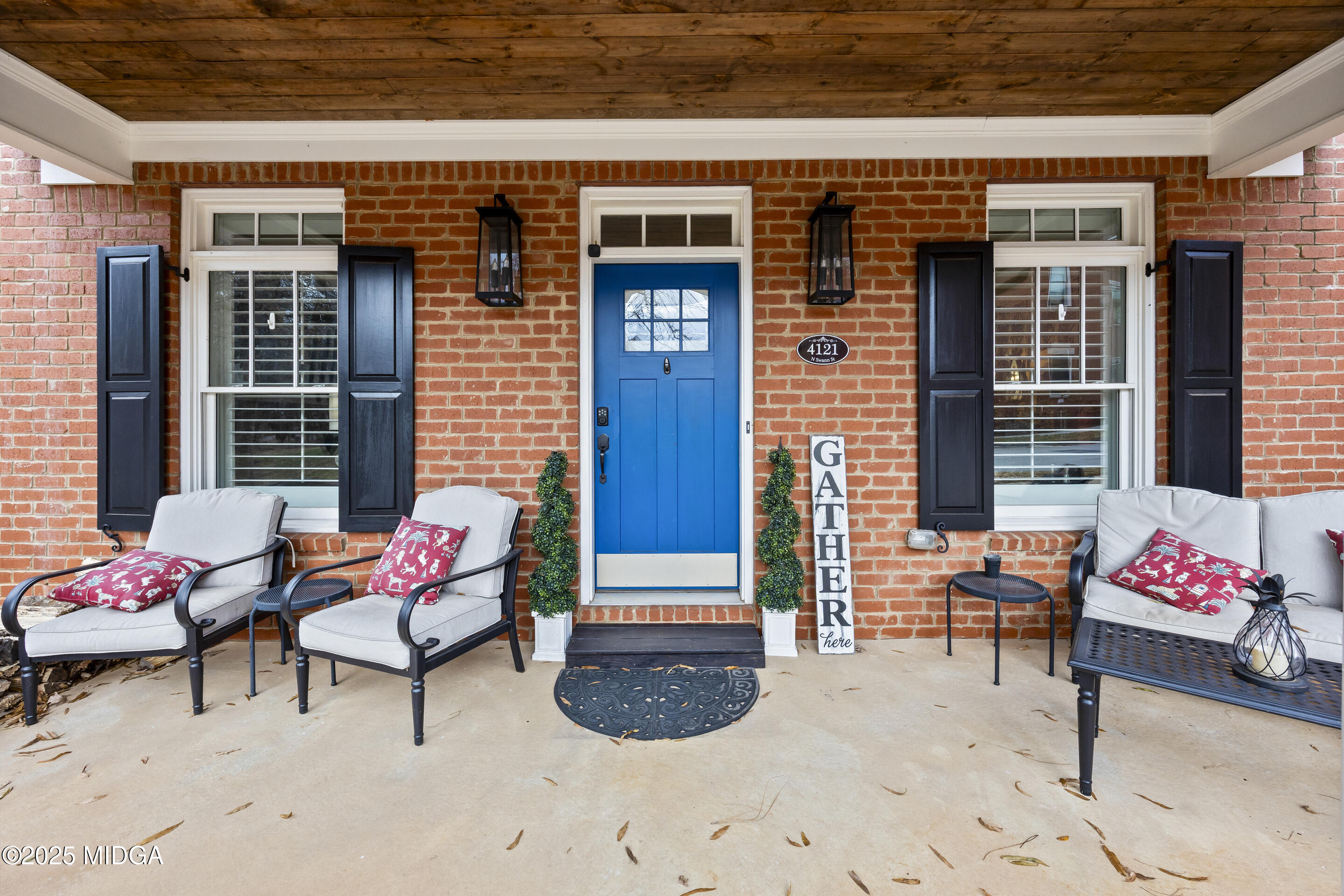 4121 North Swann Street Covington, GA 30014 - Photo 6 of 52 a outdoor living space with furniture and potted plants