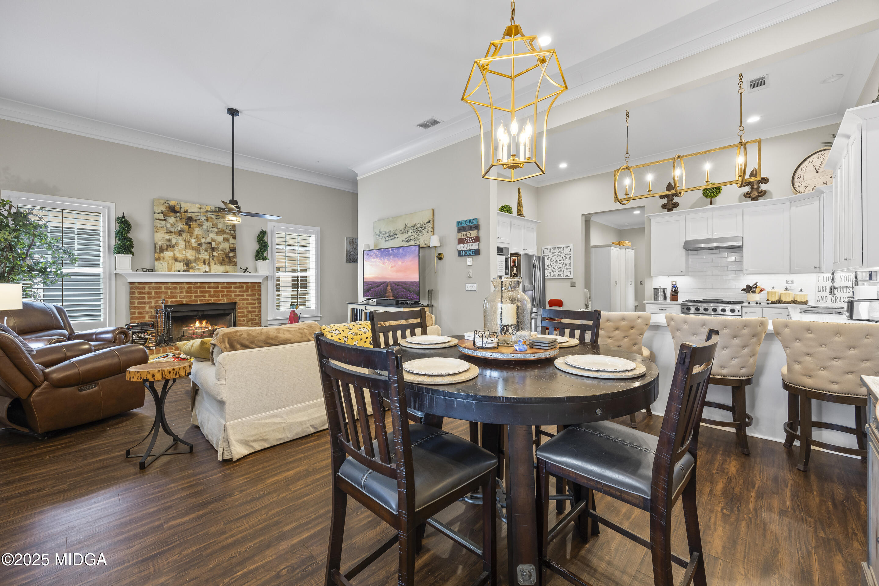 4121 North Swann Street Covington, GA 30014 - Photo 10 of 52 a view of a dining room with furniture wooden floor and chandelier