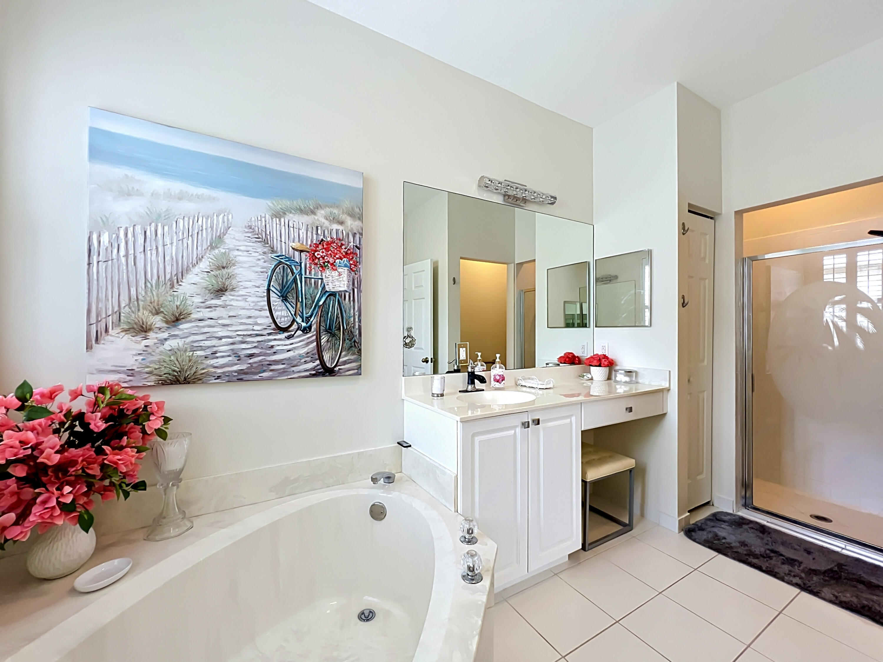 1343 Shoreline Circle Sebastian, FL 32958 - Photo 15 of 36 a bathroom with a tub sink and mirror