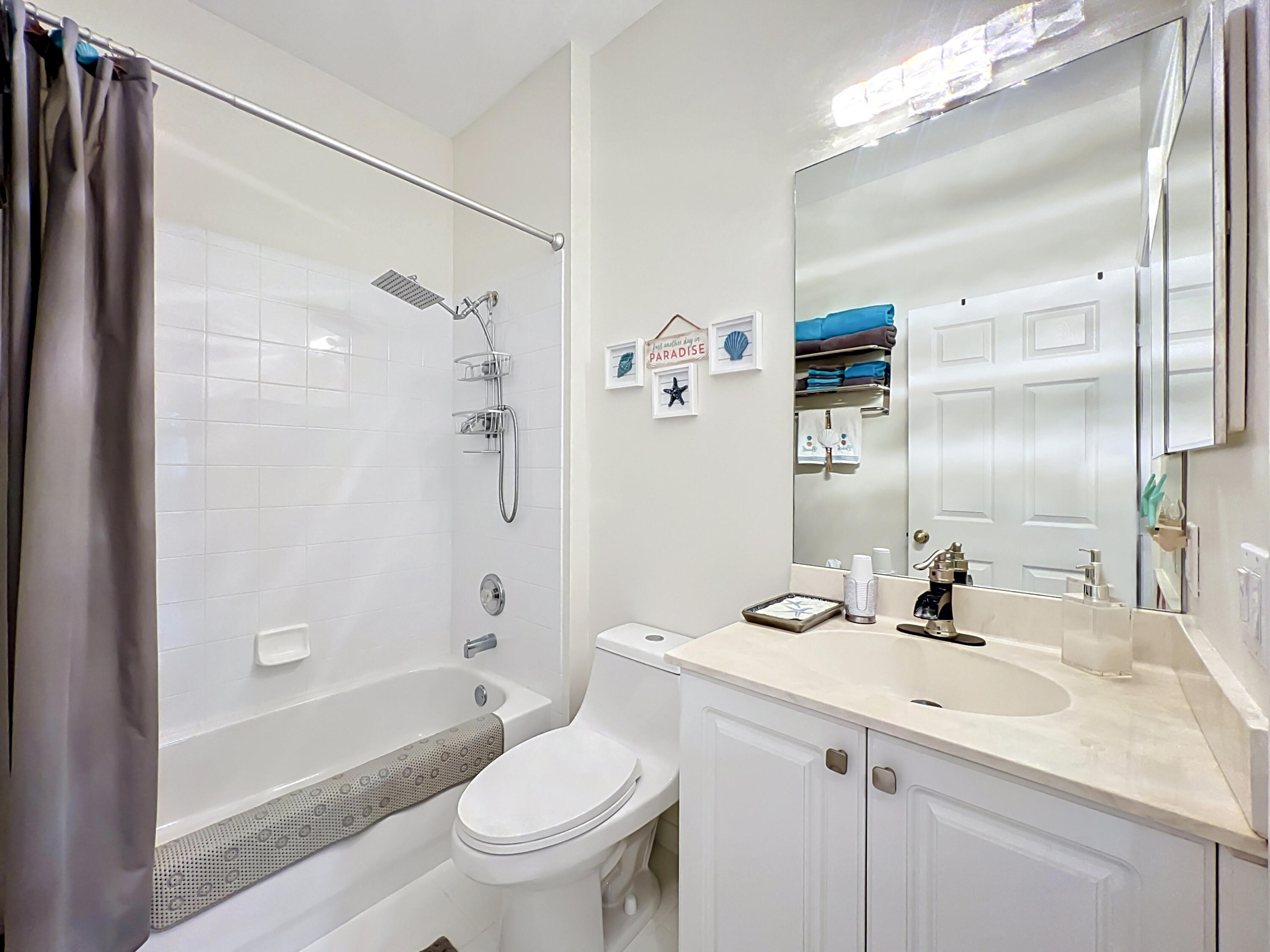 1343 Shoreline Circle Sebastian, FL 32958 - Photo 23 of 36 a bathroom with a sink a toilet and shower