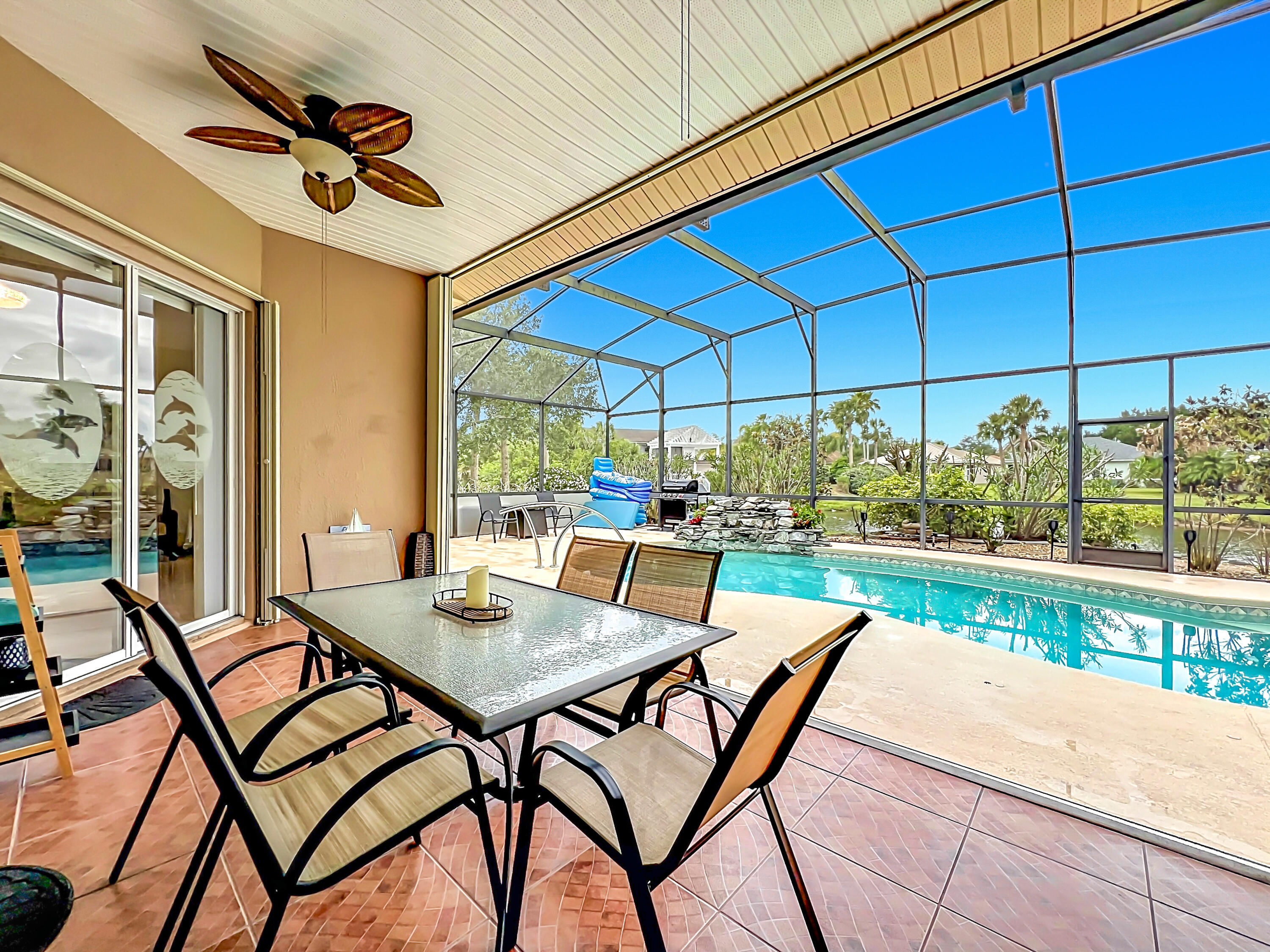 1343 Shoreline Circle Sebastian, FL 32958 - Photo 29 of 36 a view of a patio with a table and chairs under an umbrella