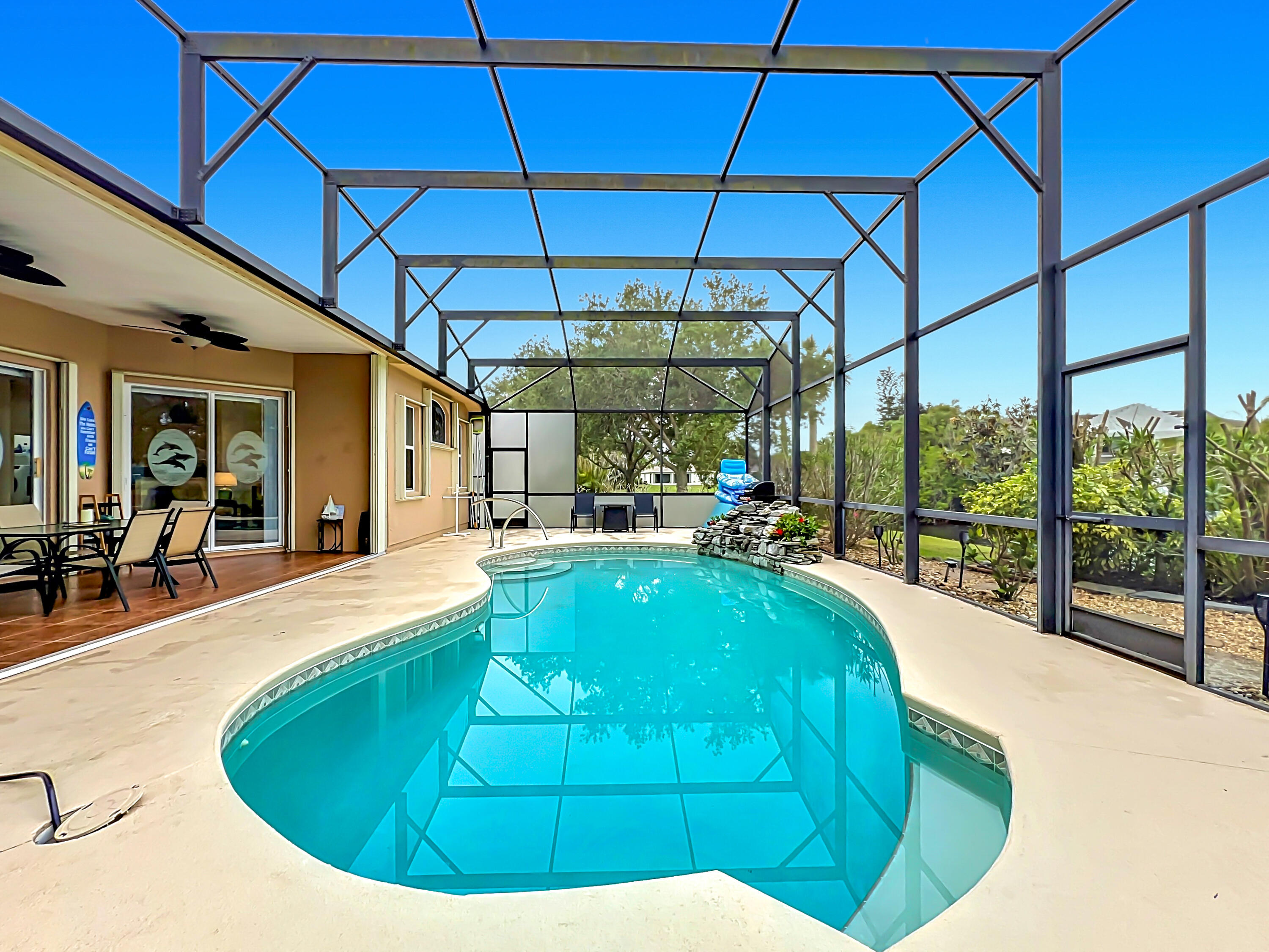 1343 Shoreline Circle Sebastian, FL 32958 - Photo 32 of 36 a view of a swimming pool with a patio