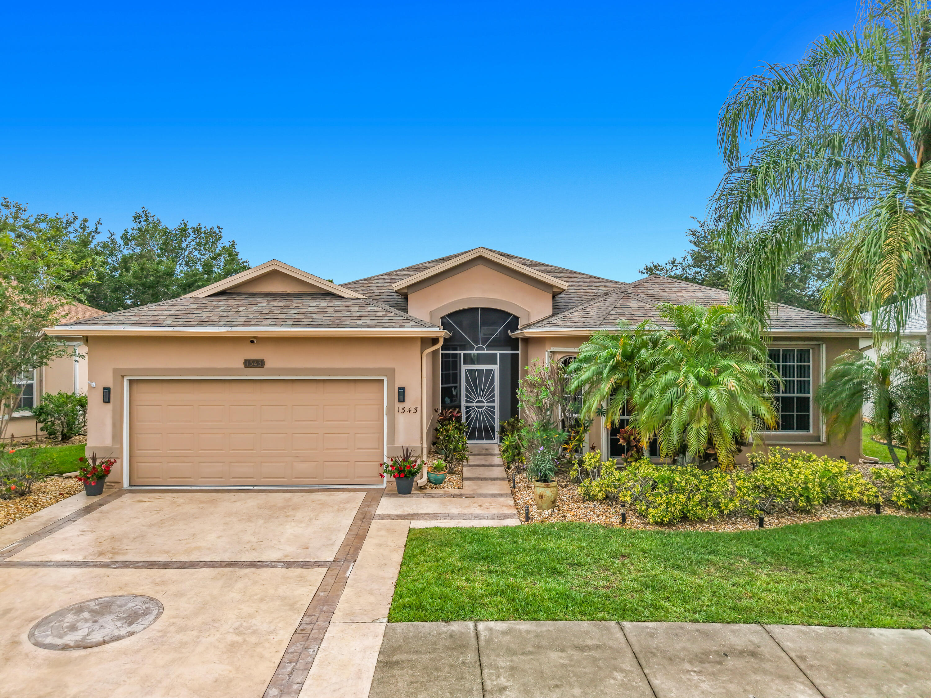 1343 Shoreline Circle Sebastian, FL 32958 - Photo 4 of 36 a front view of a house with a yard