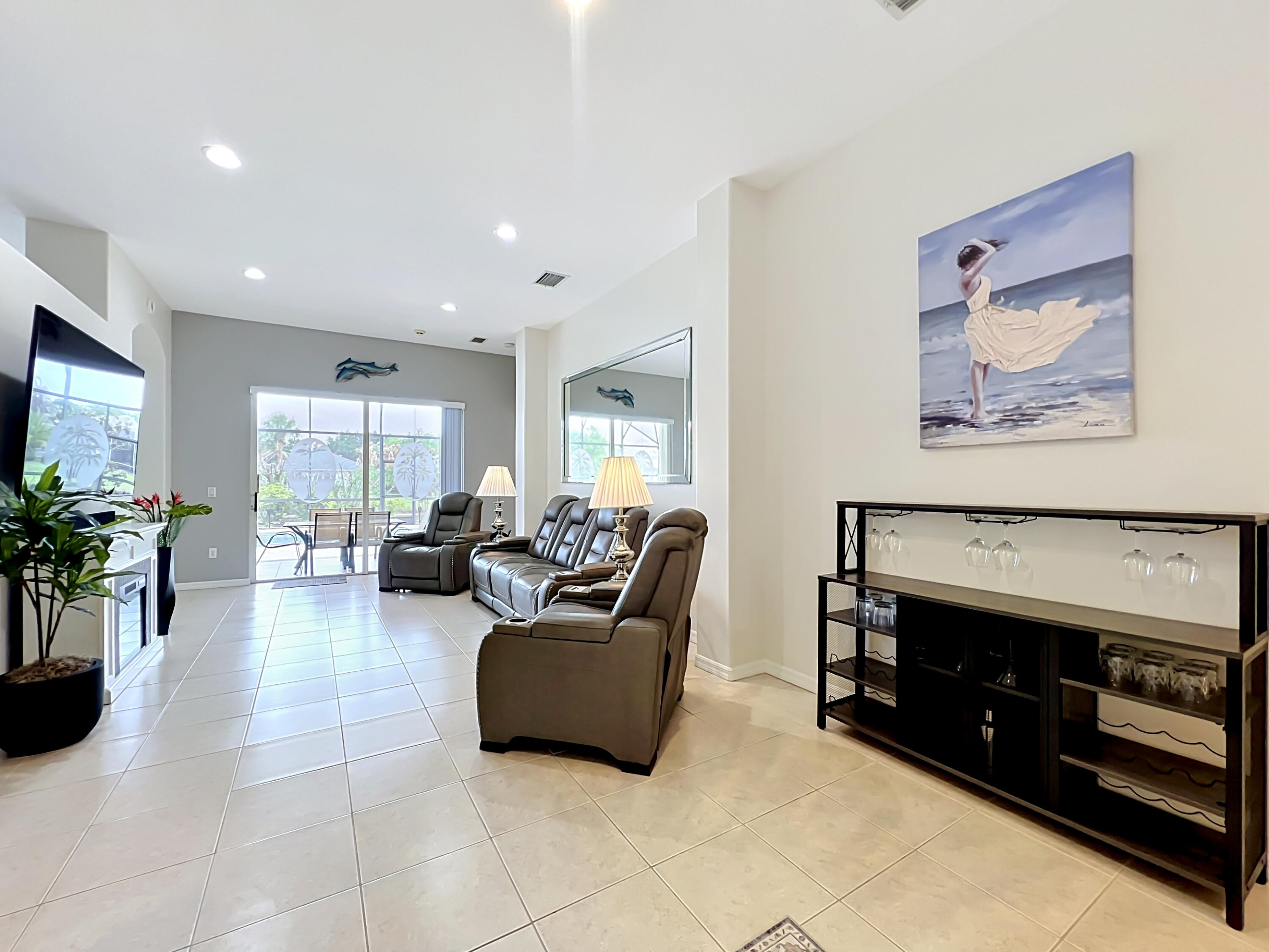 1343 Shoreline Circle Sebastian, FL 32958 - Photo 9 of 36 a living room with furniture and a flat screen tv