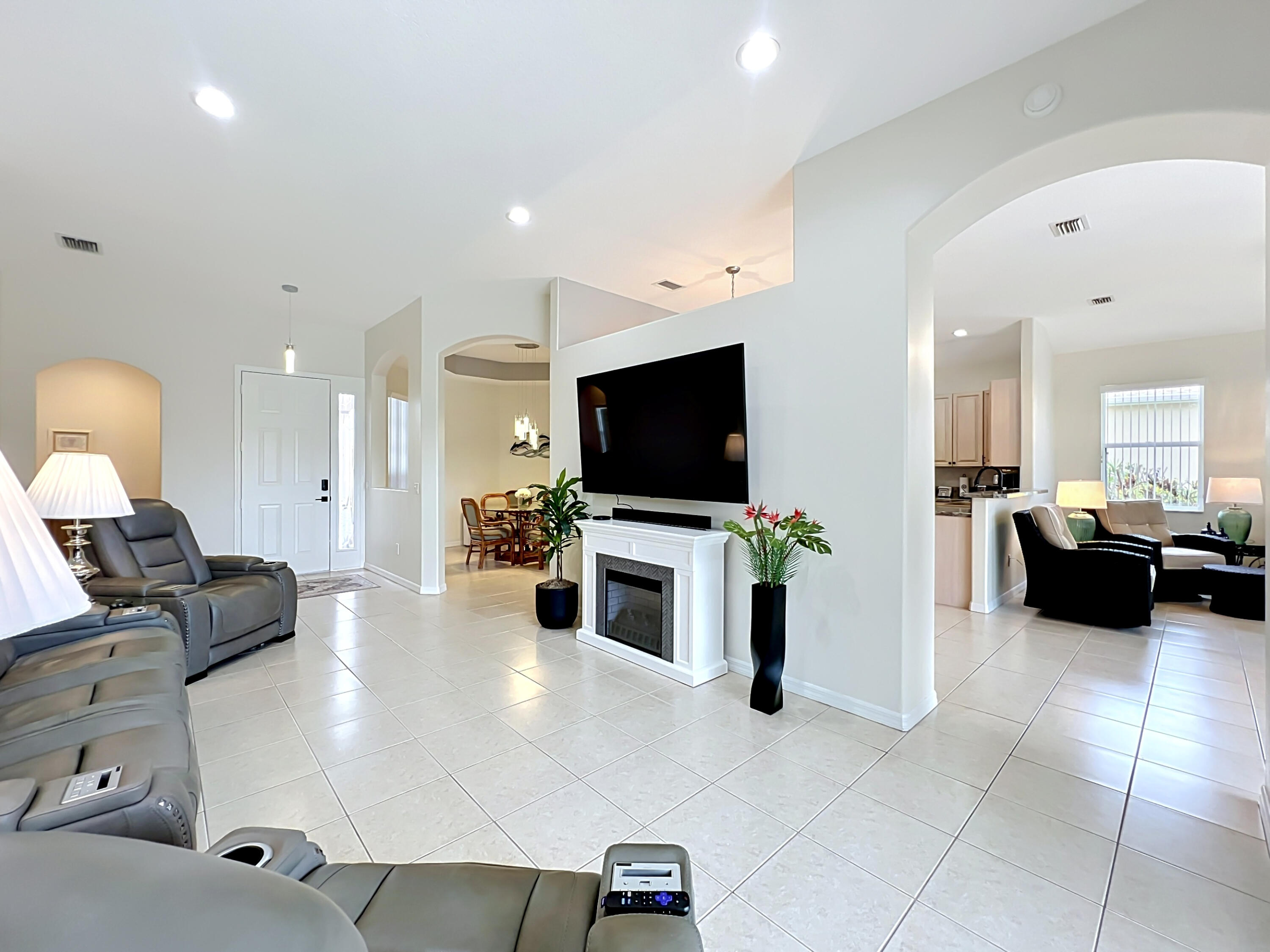 1343 Shoreline Circle Sebastian, FL 32958 - Photo 10 of 36 a living room with furniture and a flat screen tv