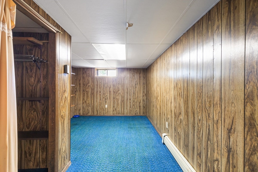99 Swansom Road Swansea, MA 02777 - Photo 32 of 42 a view of an empty room with wooden floor
