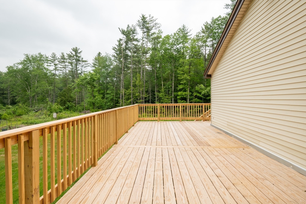 226 Raymond Road Nottingham, NH 03290 - Photo 13 of 42 a view of a wooden deck with trees