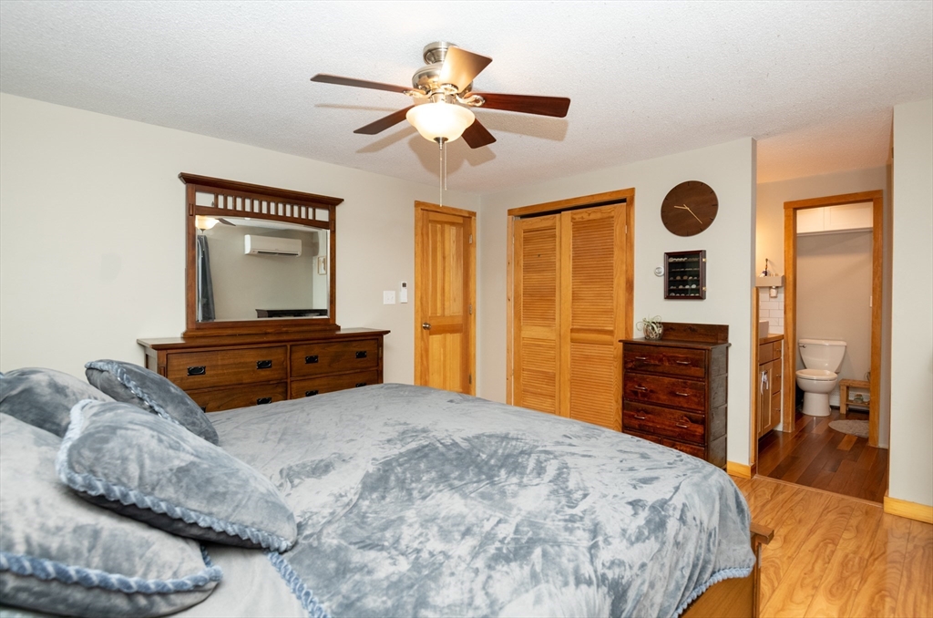 226 Raymond Road Nottingham, NH 03290 - Photo 16 of 42 a bedroom with a bed and a dresser