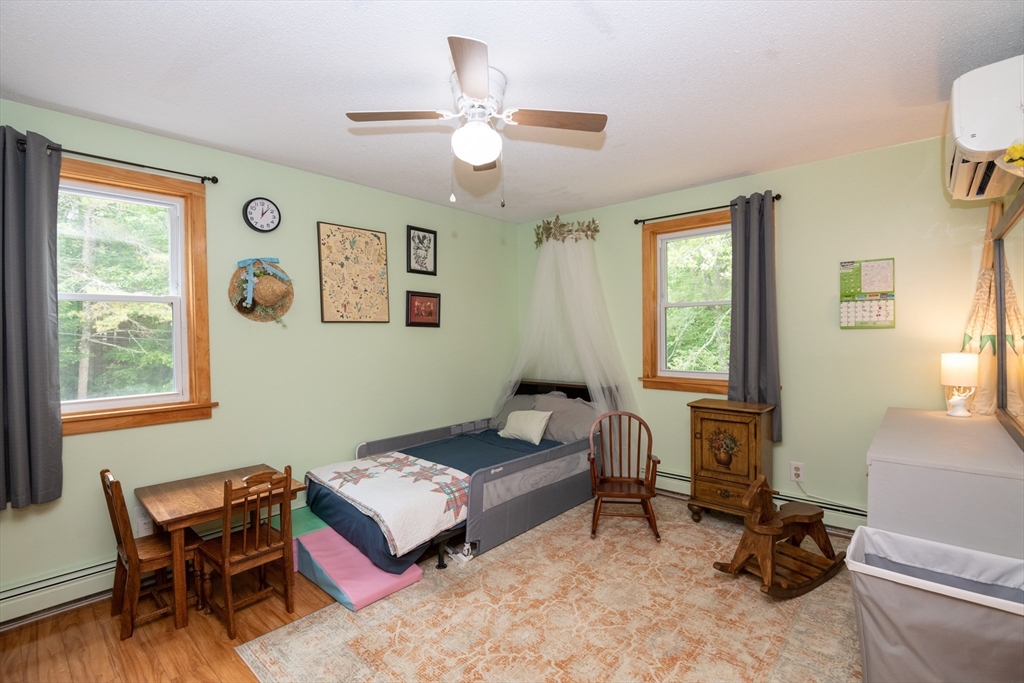 226 Raymond Road Nottingham, NH 03290 - Photo 20 of 42 a living room with furniture and a window