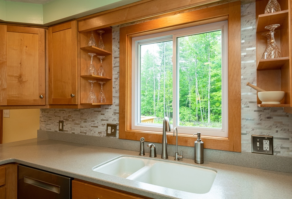 226 Raymond Road Nottingham, NH 03290 - Photo 33 of 42 a kitchen with a window a sink and a counter top space