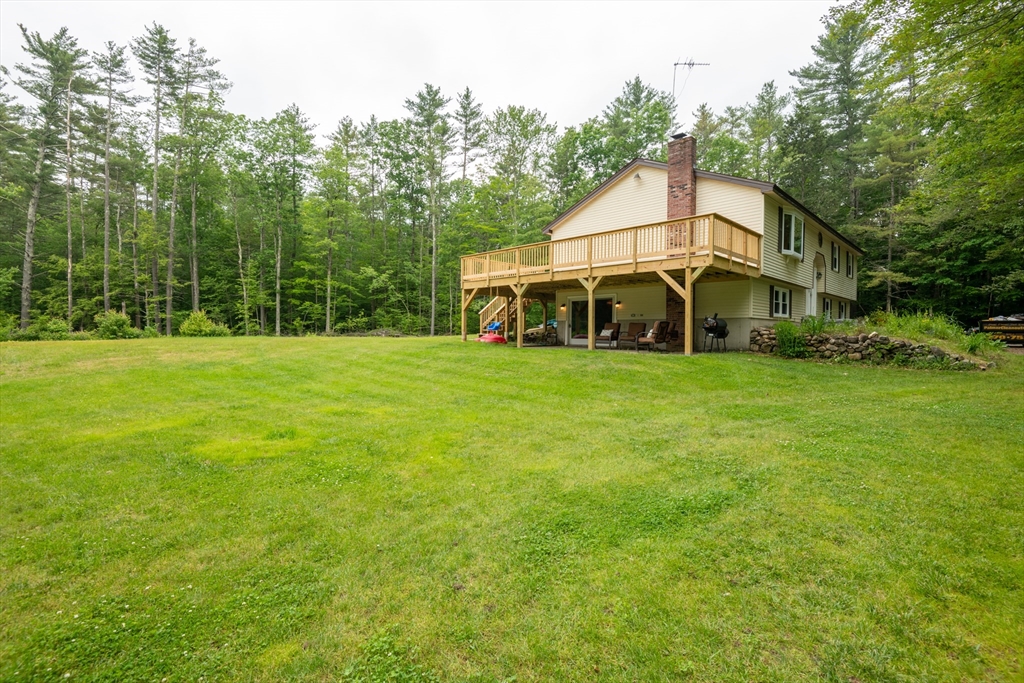 226 Raymond Road Nottingham, NH 03290 - Photo 4 of 42 a view of a house with a yard