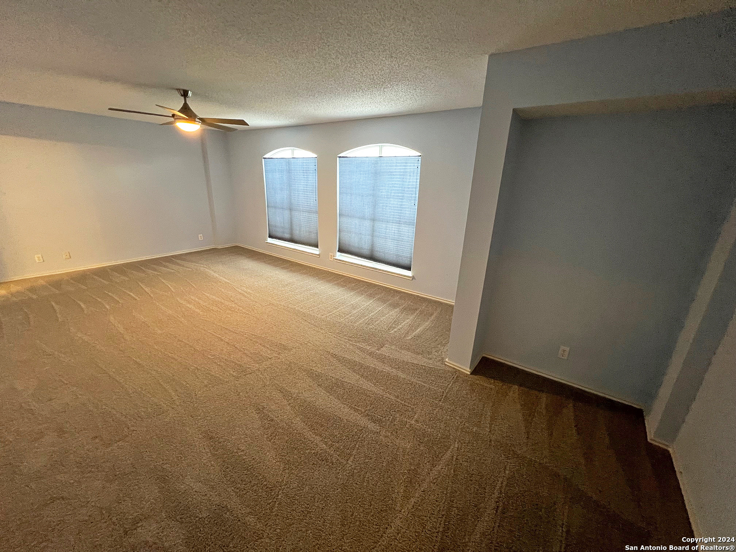 7514 Autumn Ledge Converse, TX 78109 - Photo 16 of 37 wooden floor in an empty room with a window