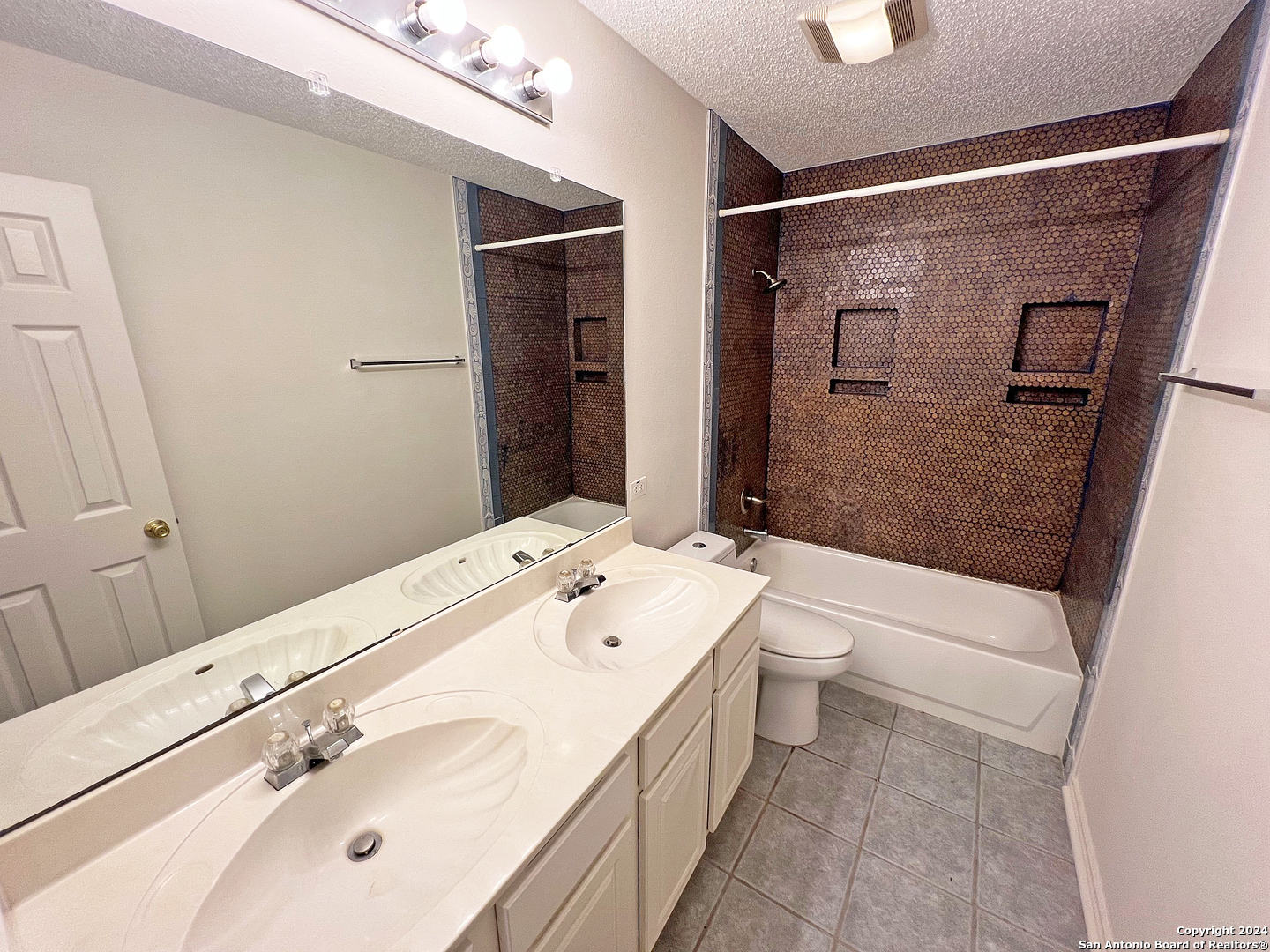 7514 Autumn Ledge Converse, TX 78109 - Photo 28 of 37 a bathroom with a sink a toilet and shower