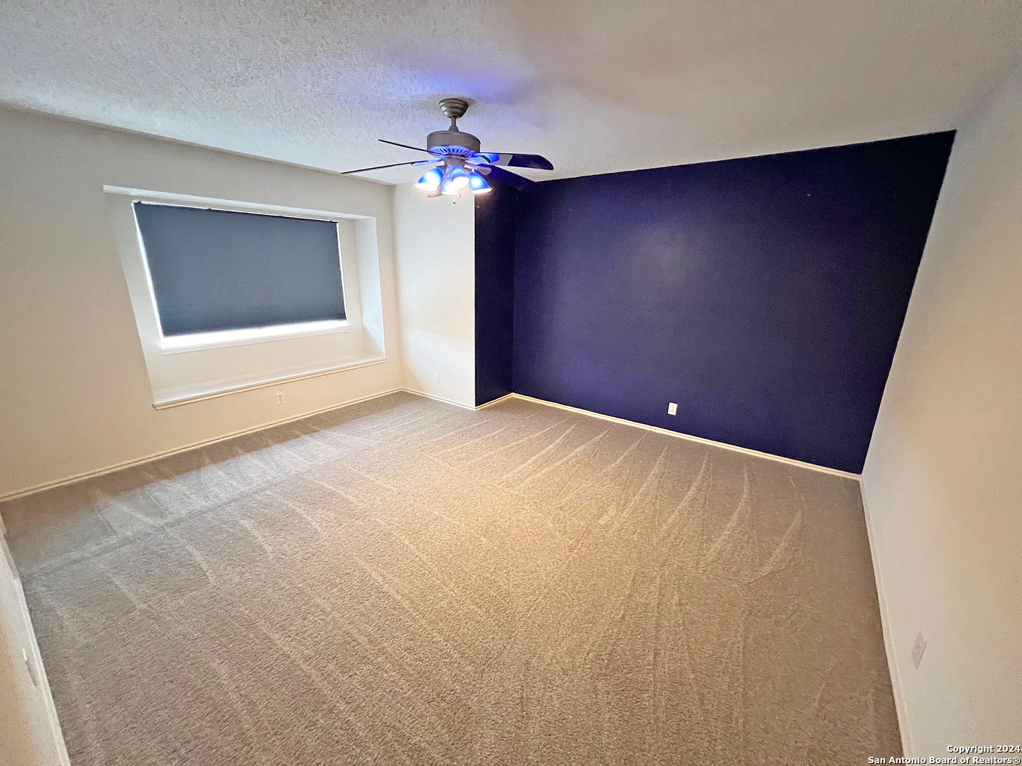 7514 Autumn Ledge Converse, TX 78109 - Photo 30 of 37 a view of an empty room with a chandelier fan