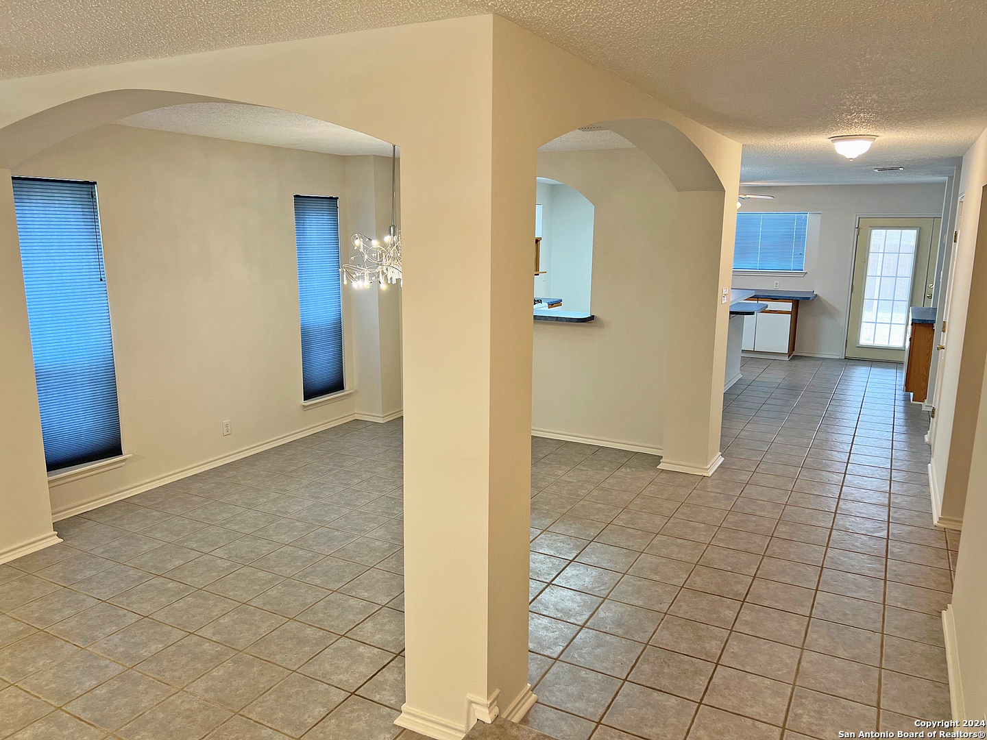 7514 Autumn Ledge Converse, TX 78109 - Photo 3 of 37 a view of a hallway with wooden floor and a living room