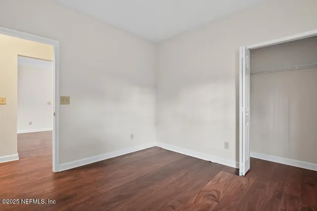 a bathroom with a granite countertop toilet a sink and a bathtub