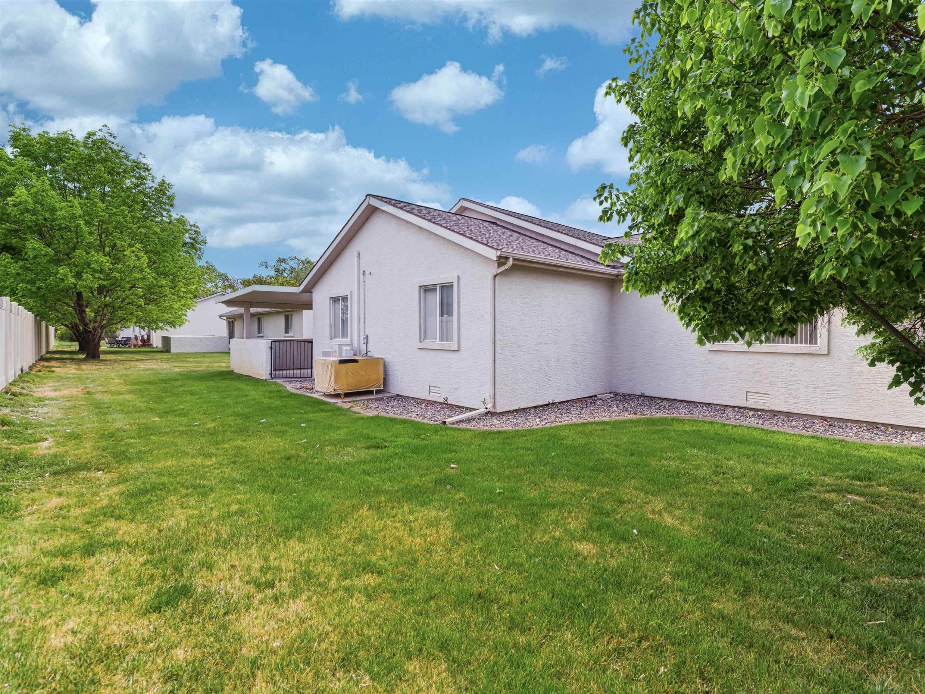 3082 Shadowbrook Court Grand Junction, CO 81504 - Photo 26 of 28 a view of a backyard with plants and a garden