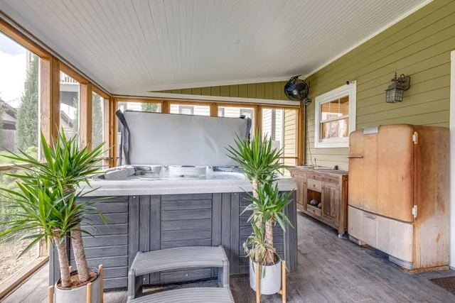a view of a livingroom with furniture and a potted plant