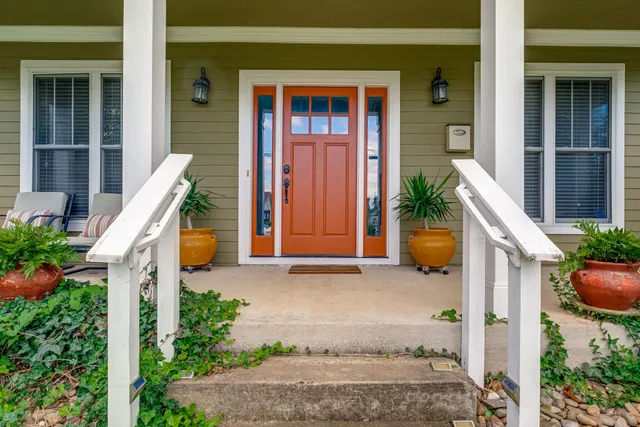 a view of a house with tub and potted plants