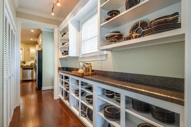 a kitchen with stainless steel appliances granite countertop a stove and a refrigerator
