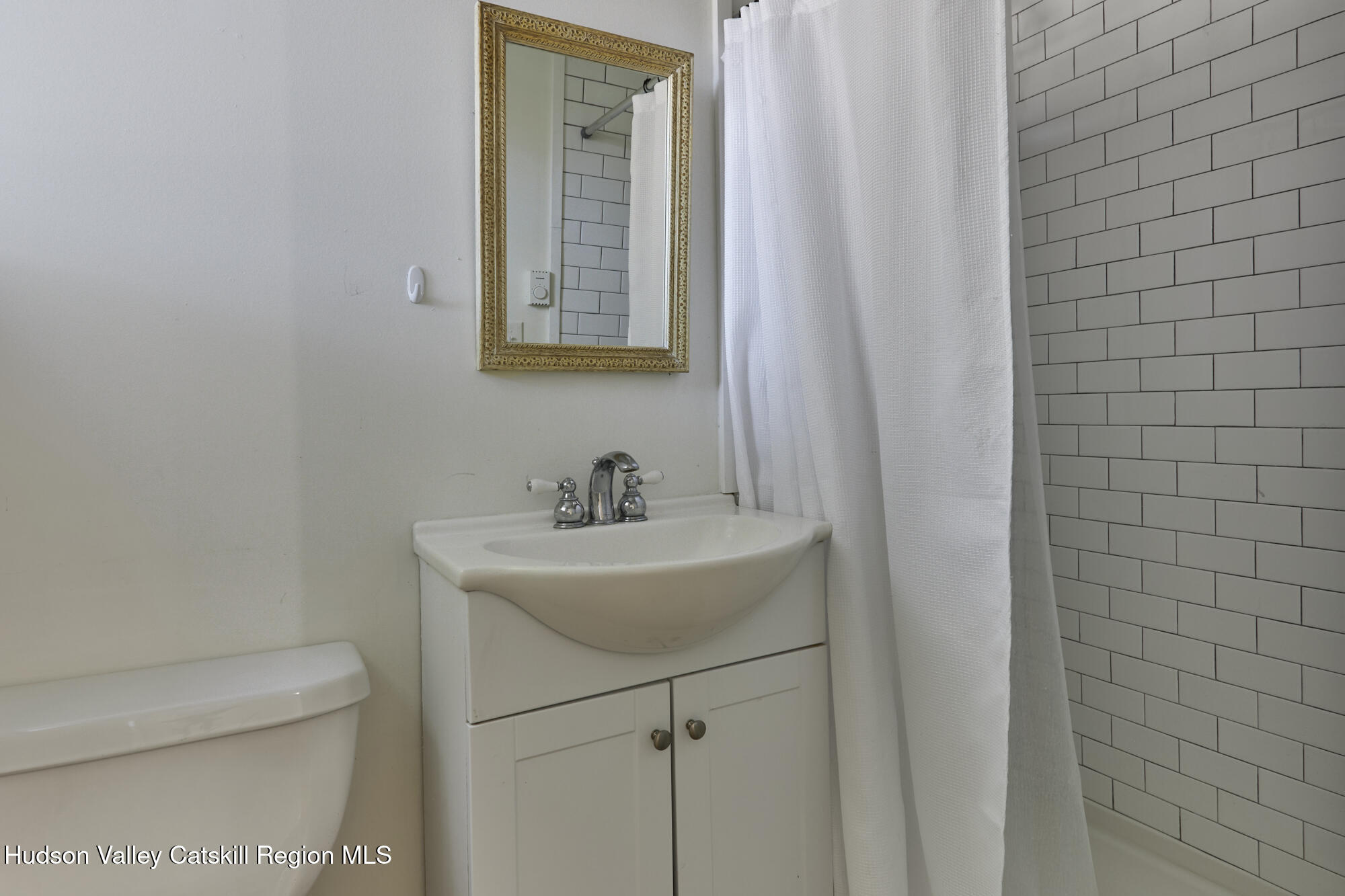 361 Allen Road Salt Point, NY 12578 - Photo 26 of 28 a bathroom with a sink toilet and mirror