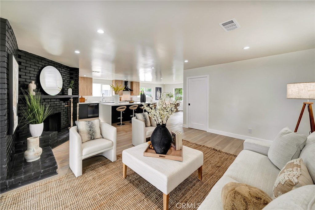 6512 Franrivers Avenue West Hills, CA 91307 - Photo 13 of 33 a living room with furniture and a wooden floor