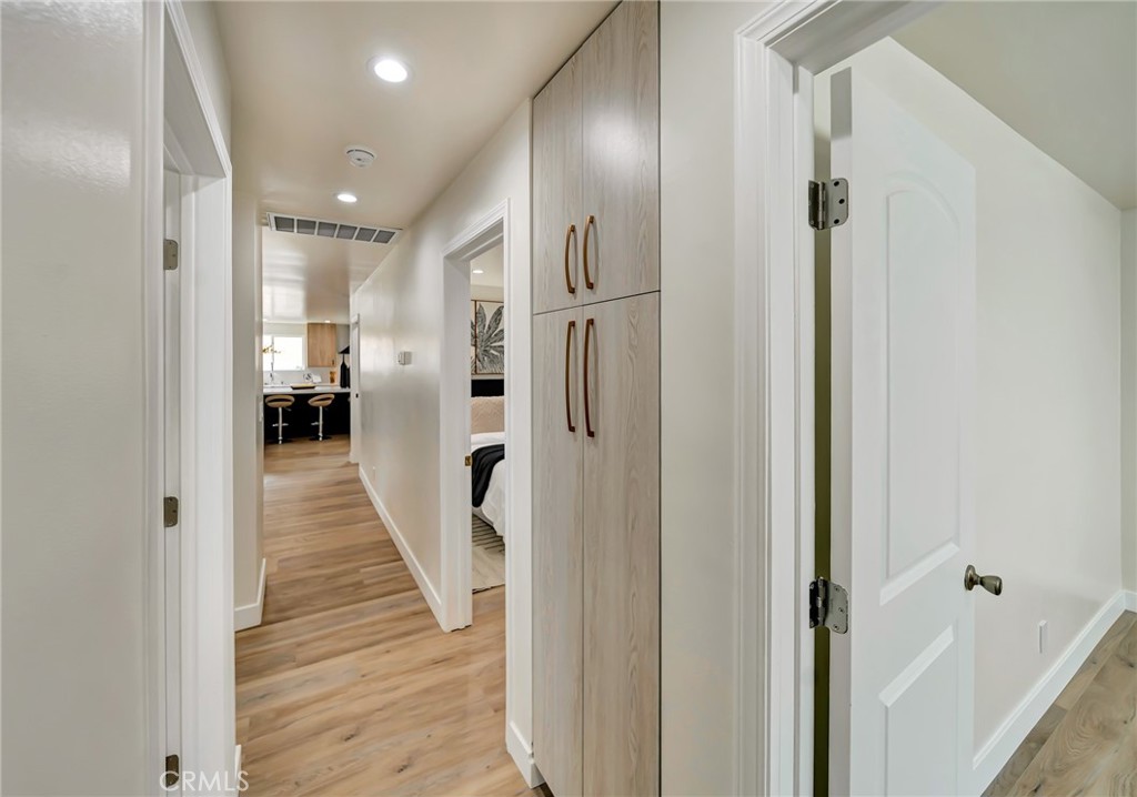 6512 Franrivers Avenue West Hills, CA 91307 - Photo 18 of 33 a view of a hallway with wooden floor and a bathroom