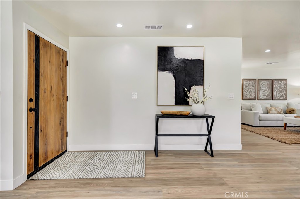 6512 Franrivers Avenue West Hills, CA 91307 - Photo 2 of 33 a living room with furniture and a wooden floor