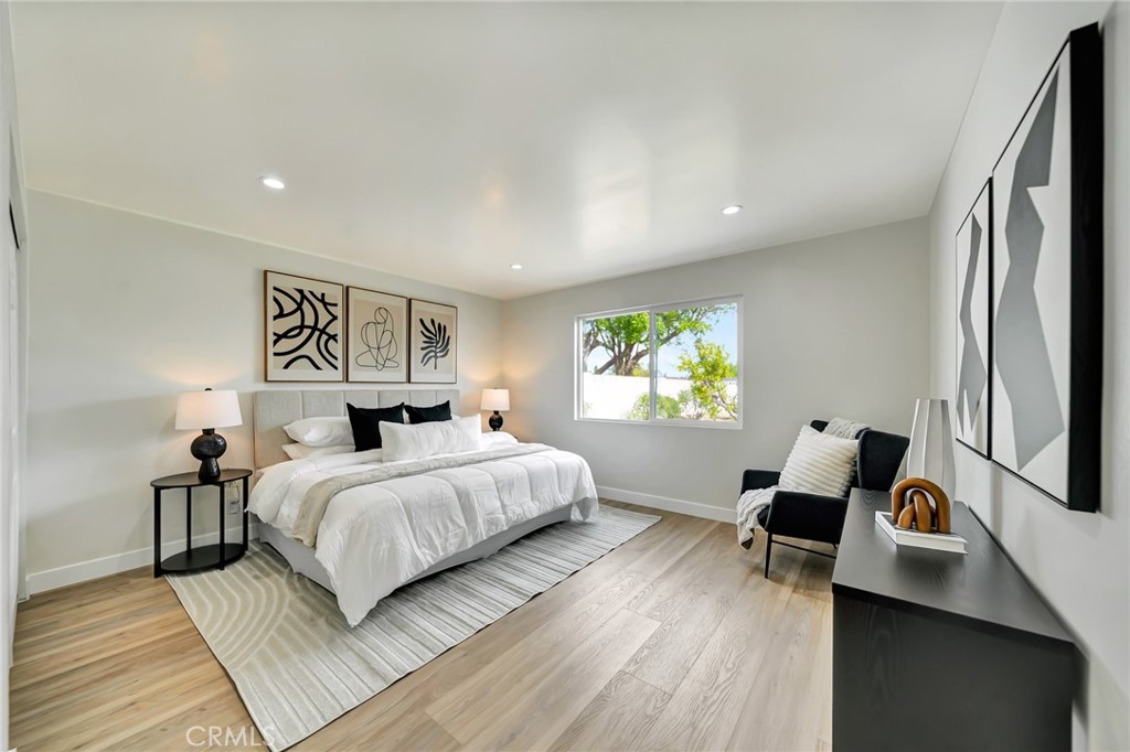 6512 Franrivers Avenue West Hills, CA 91307 - Photo 24 of 33 a bedroom with a bed and wooden floor