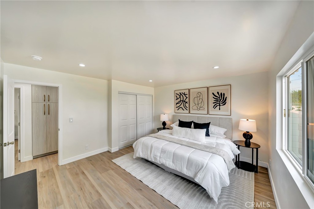 6512 Franrivers Avenue West Hills, CA 91307 - Photo 25 of 33 a bedroom with a bed and a painting on the wall