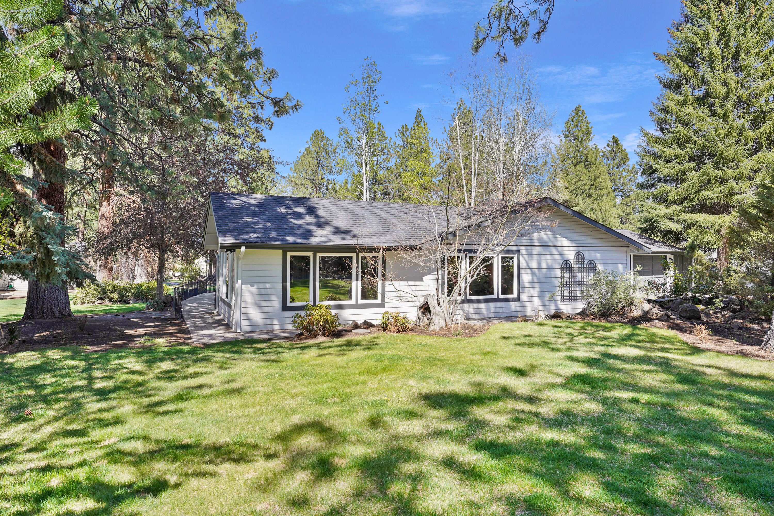 20452 Mainline Road Bend, OR 97702 - Photo 31 of 40 a front view of a house with garden