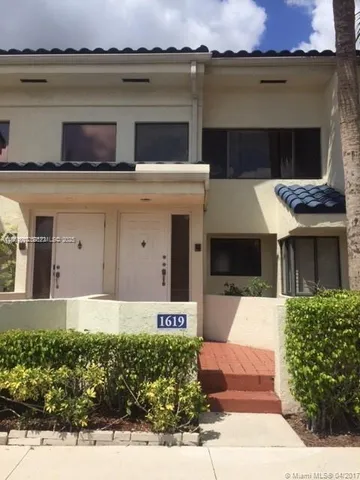 a front view of a house with yard