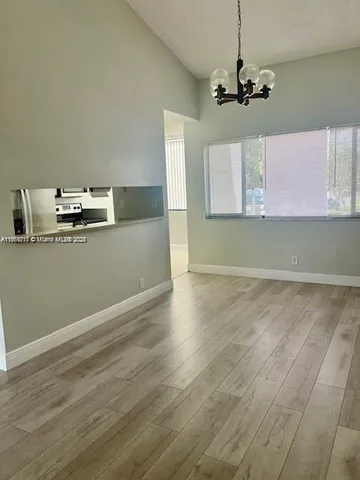 a kitchen with a stove and a microwave