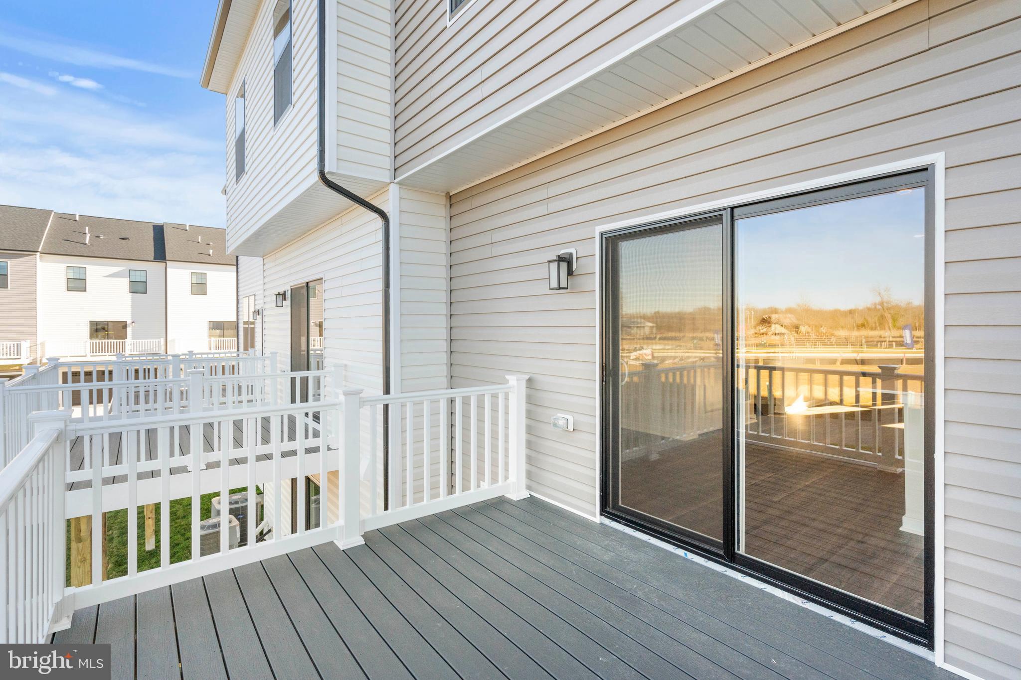 7528 Fern Gully Way Brandywine, MD 20613 - Photo 3 of 4 a view of a balcony with wooden floor