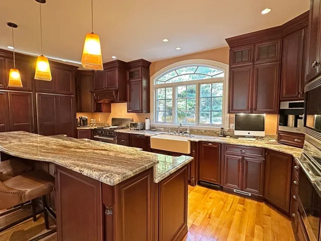 a kitchen with a sink and wooden cabinets