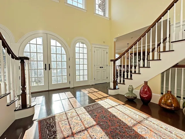 a view of an entryway with wooden floor