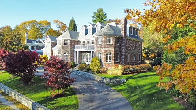 an aerial view of residential house with outdoor space and swimming pool