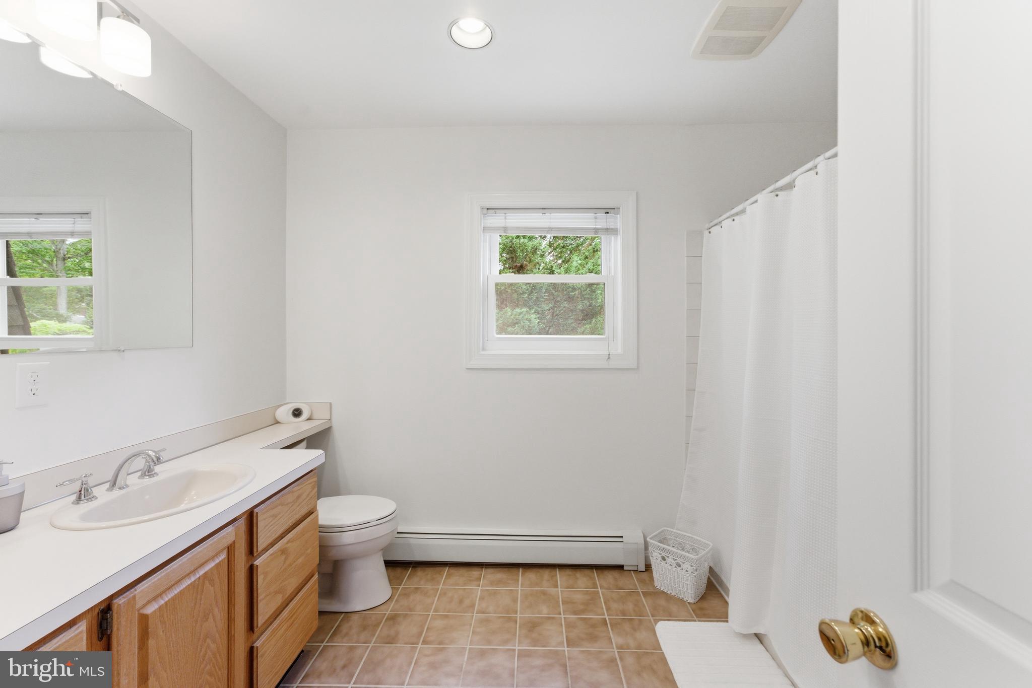 2100 Edgewater Parkway Silver Spring, MD 20903 - Photo 34 of 46 a bathroom with a sink and a toilet
