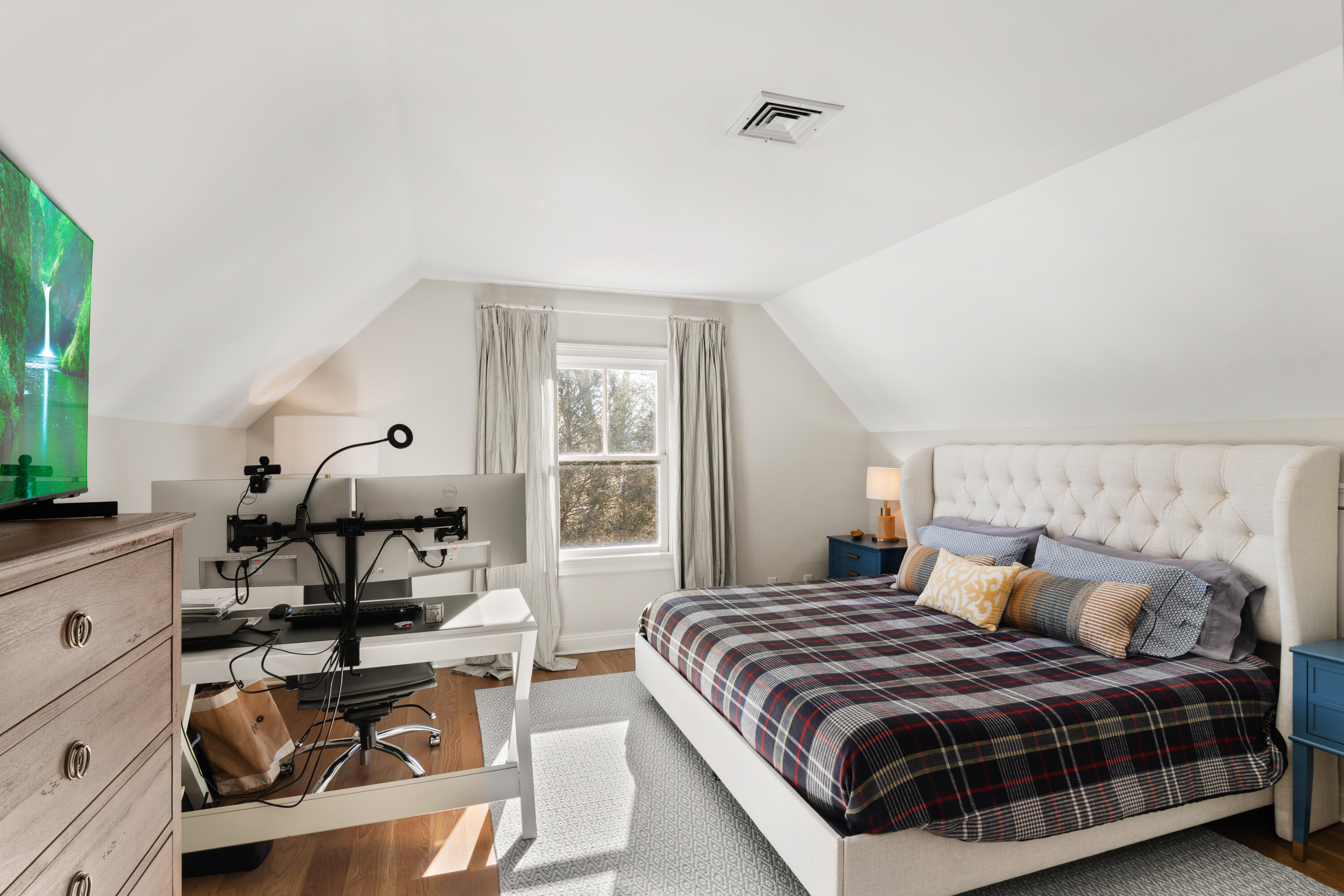 12 1/2 Ridgewood Road Rowayton, CT 06853 - Photo 17 of 25 a bedroom with a bed a table window and couch